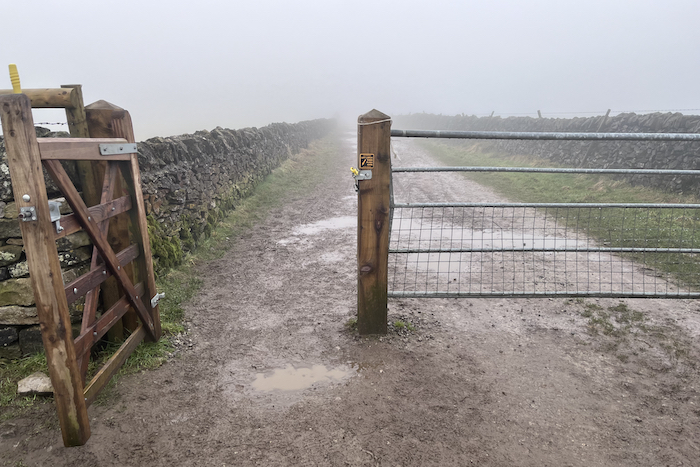 Head through the wooden single access gate and follow the path towards Winnats Road