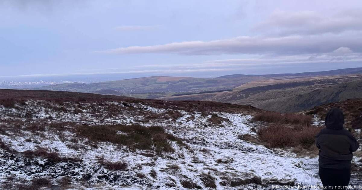 Bleaklow Moor with snow on the ground and blue skies