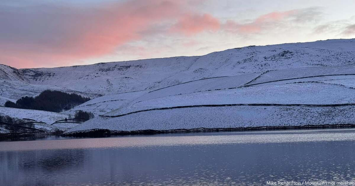 Kinder Scout at sunrise after snow fall with Kinder Reservoir in front