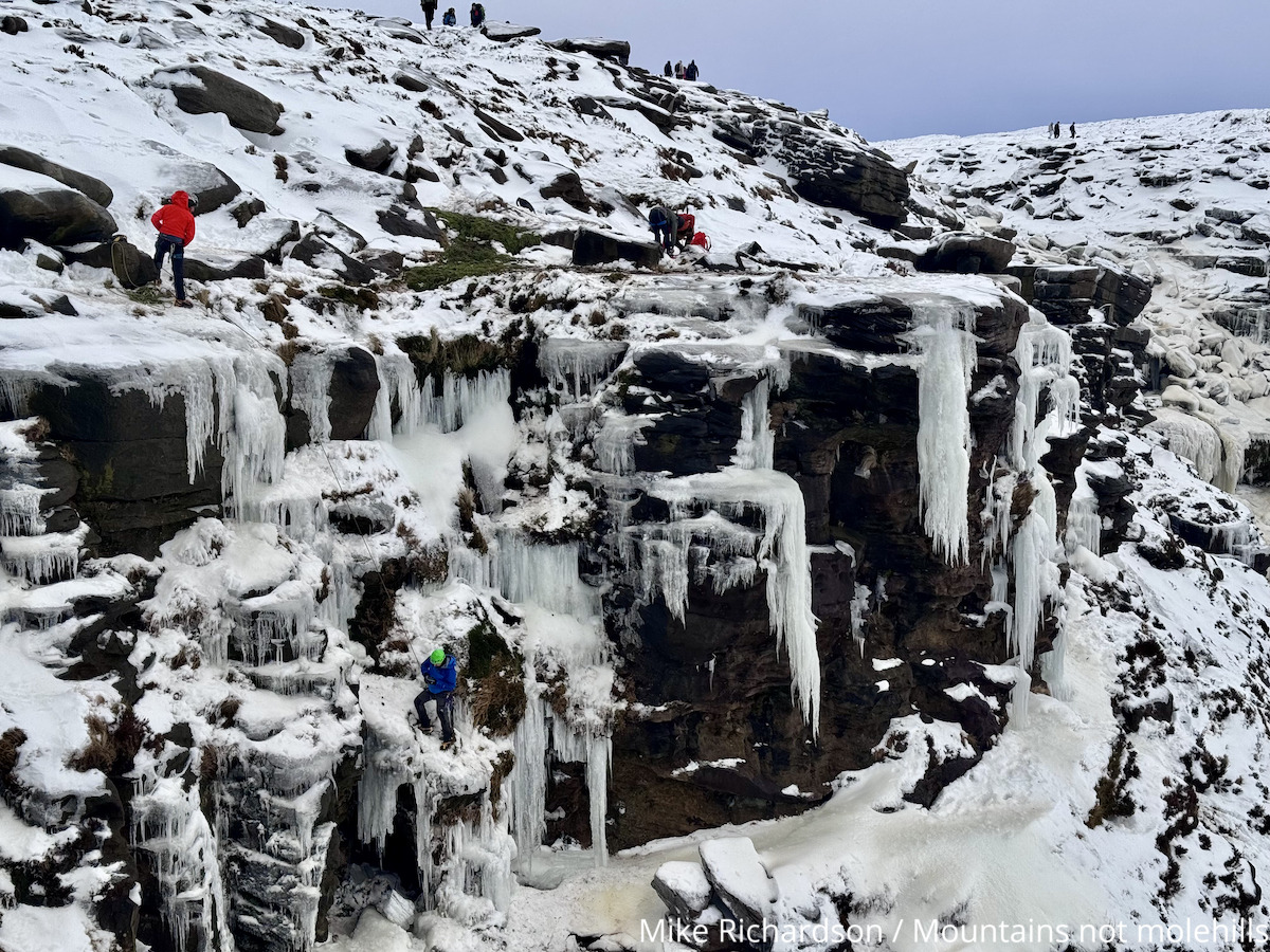 Ice Climbers in winter on Kinder Scout close to Kinder Downfall